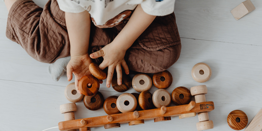 How do toys support a child's development?